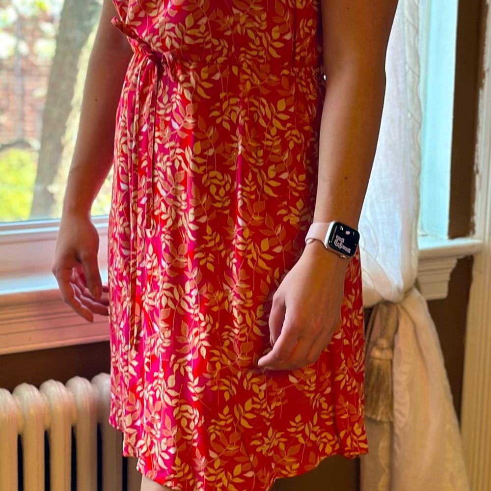 Lightweight dress from Paris with adjustable tie waist. Never worn.